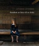 Omslag: Handbok att bära till en dräkt